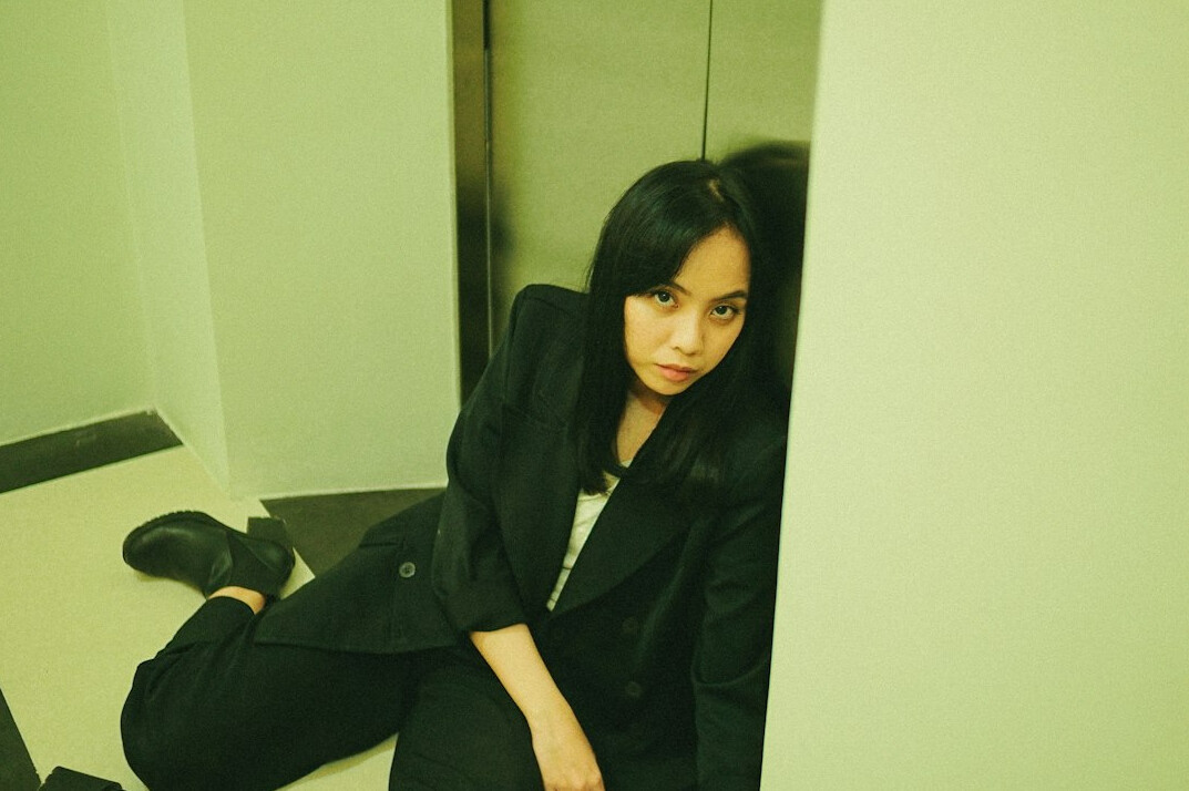 Portrait of a professional woman with dark hair in a blazer